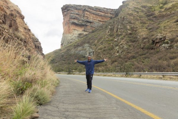 Black man standing in the mountains