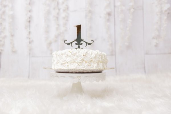 1st birthday cake on a stand