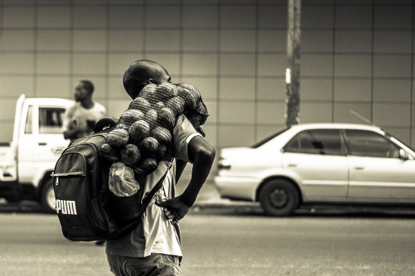 Man carrying a sack of potatoes