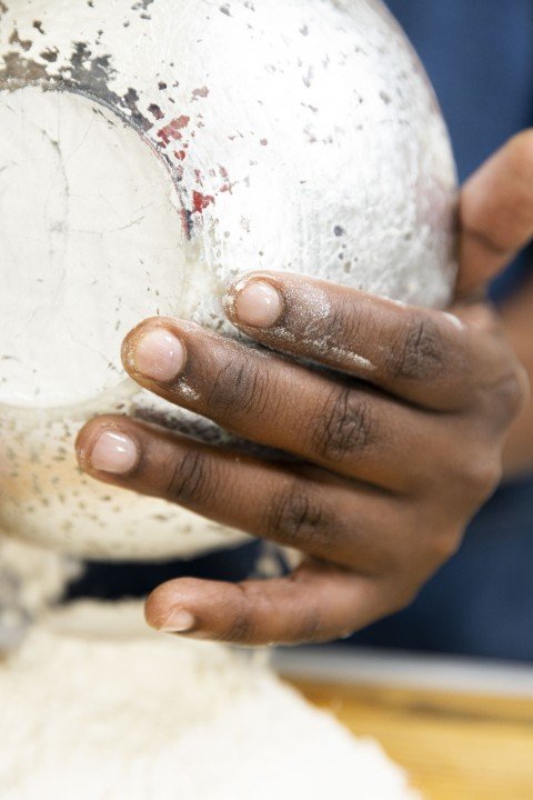 Holding a bowl with flour