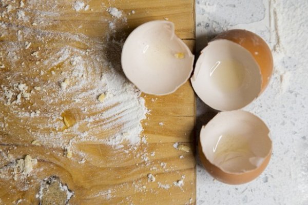Egg shells on a table with flour
