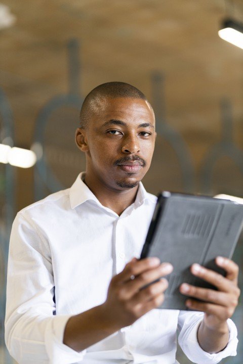 Black man looking at ipad