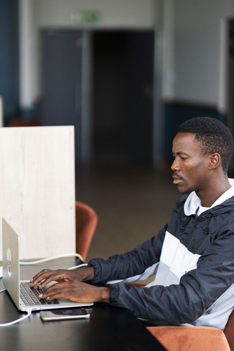 Black man working on the laptop