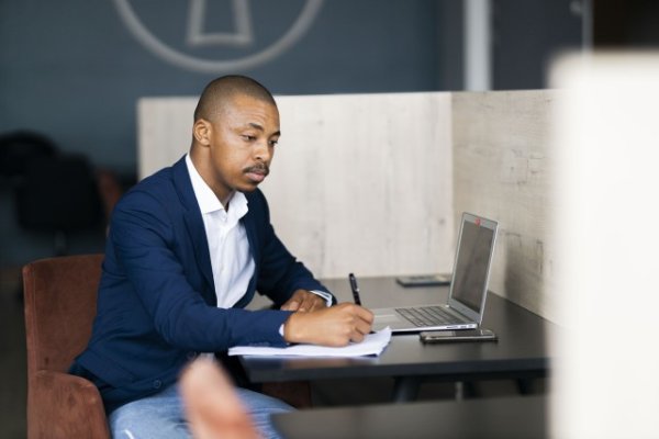 Black business man taking notes