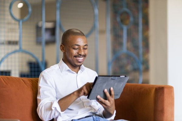 Black man looking at ipad