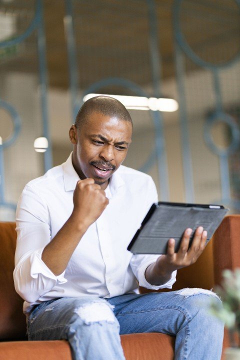 Black man looking at ipad