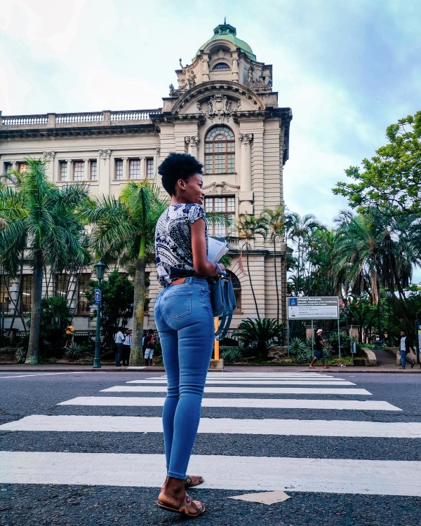Black girl crossing the road
