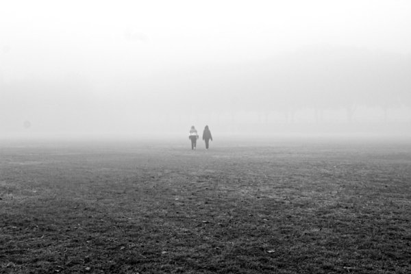 Couple walking in the mist