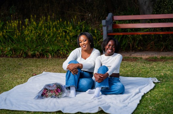 Happy African mother enjoying an afternoon at the park with her daughter