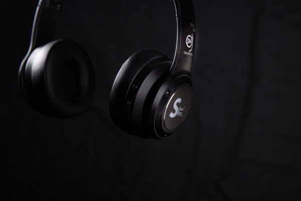 Headphones on a black backdrop