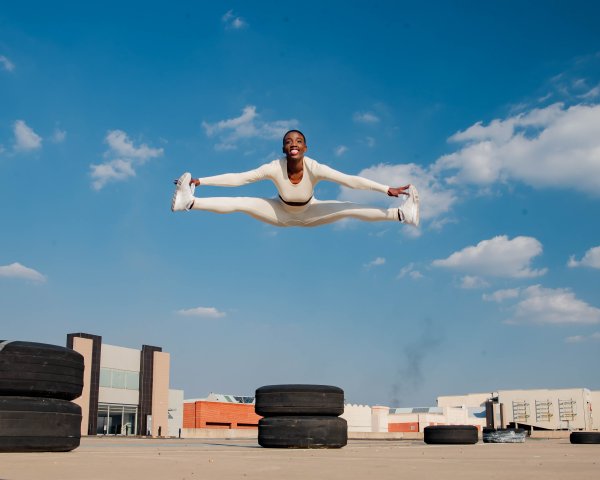 Black athlete jumping in the air