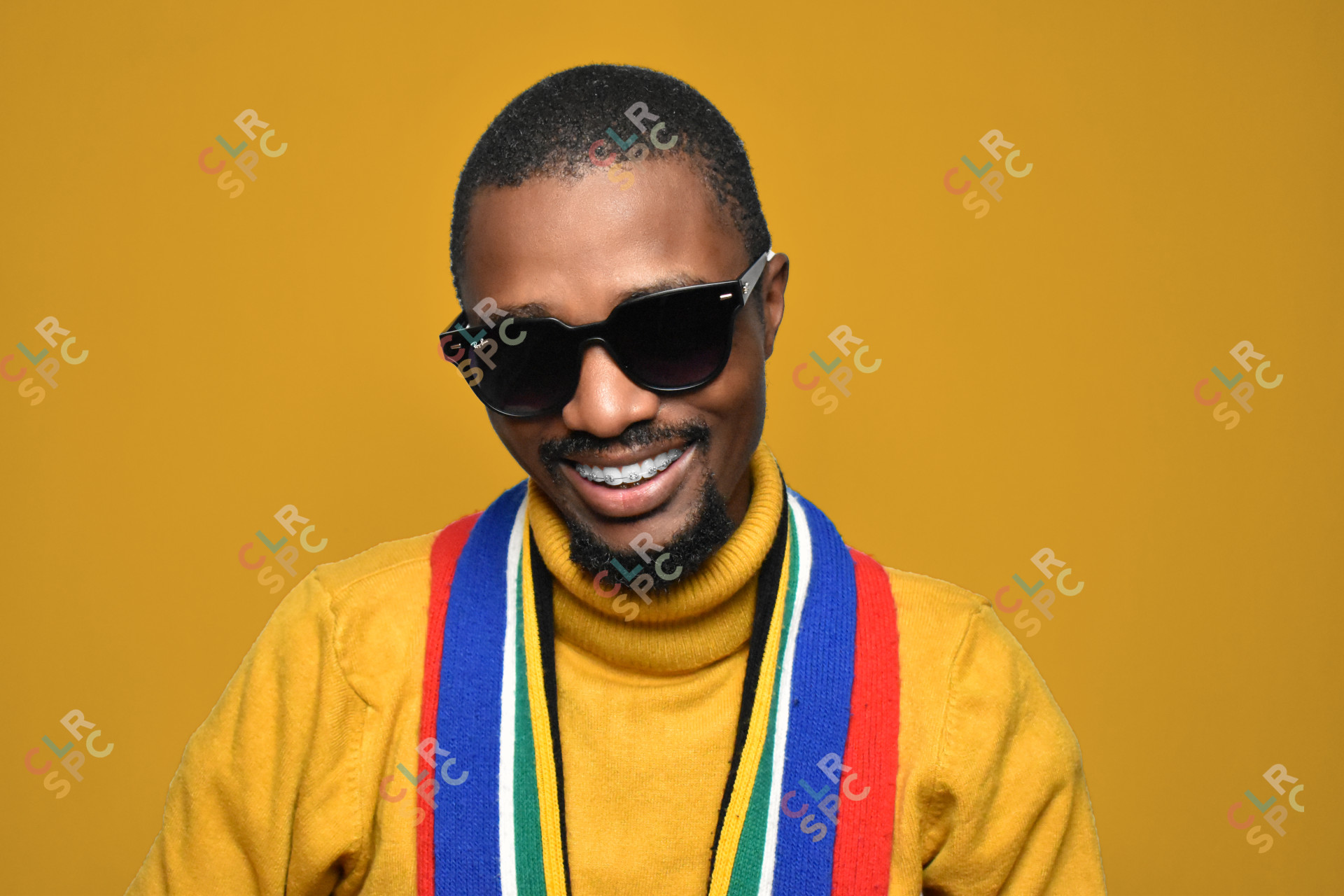 Black man wearing glasses in a studio