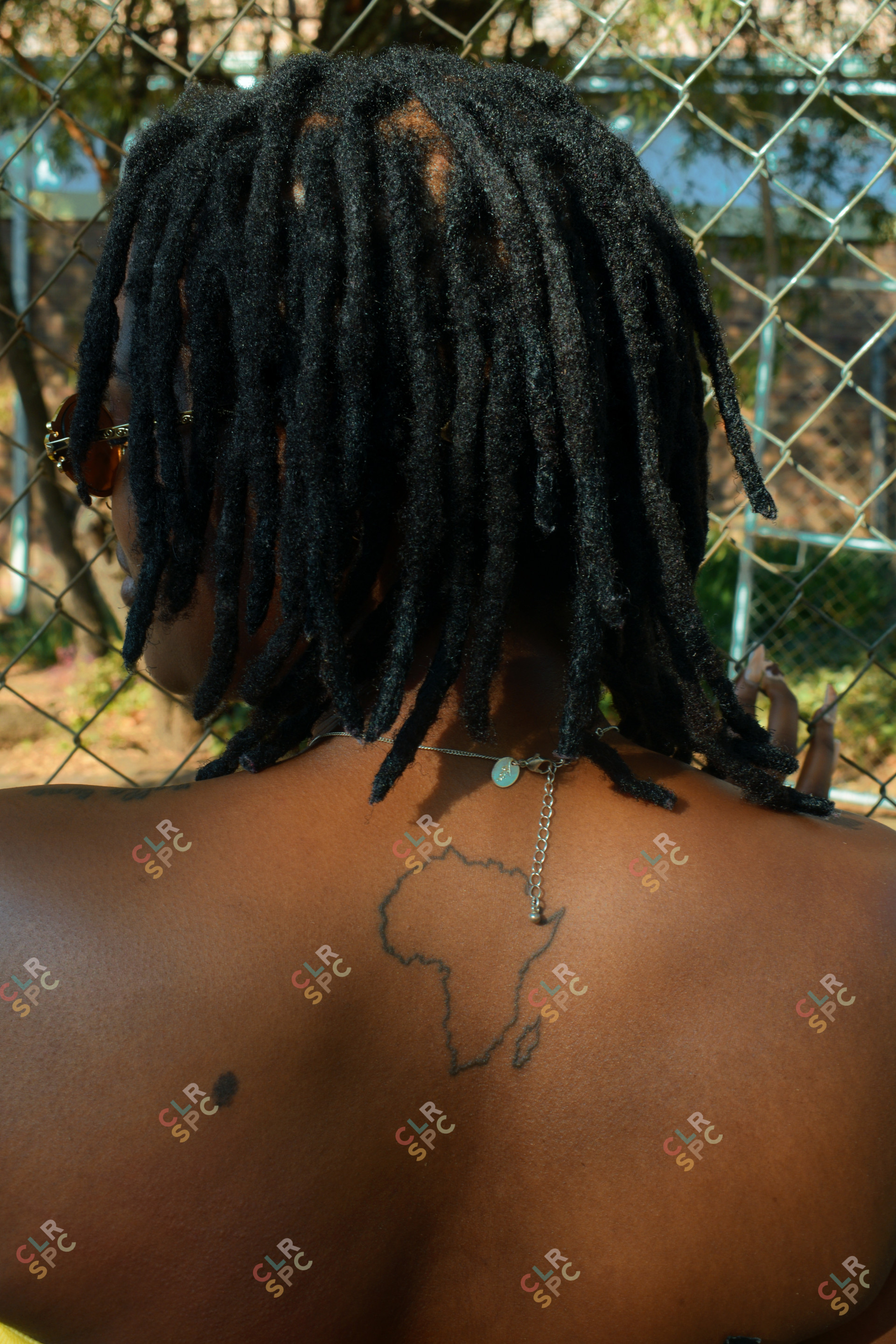 Mama Africa tattoo on a black skinned woman