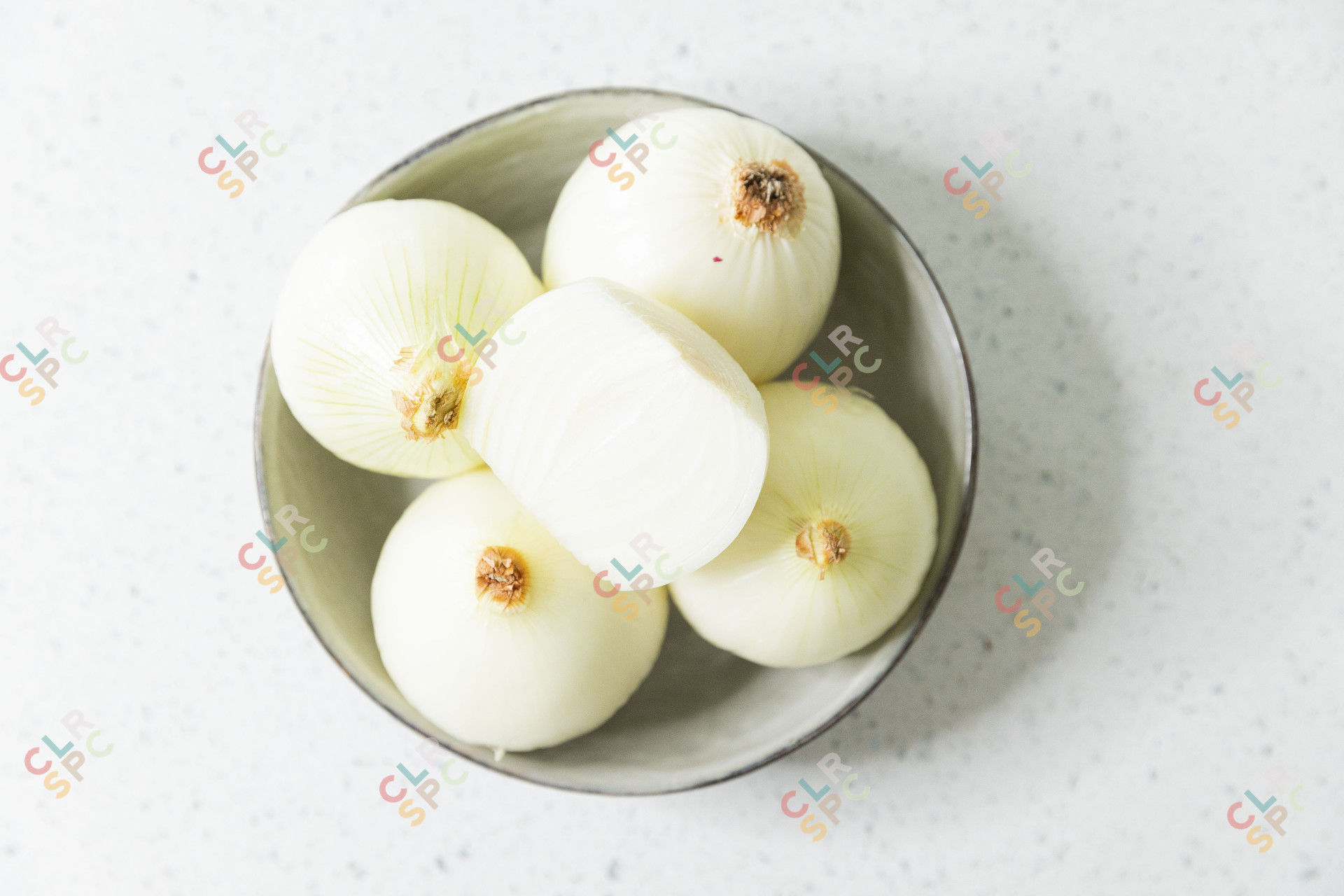 Pealed onions in a bowl
