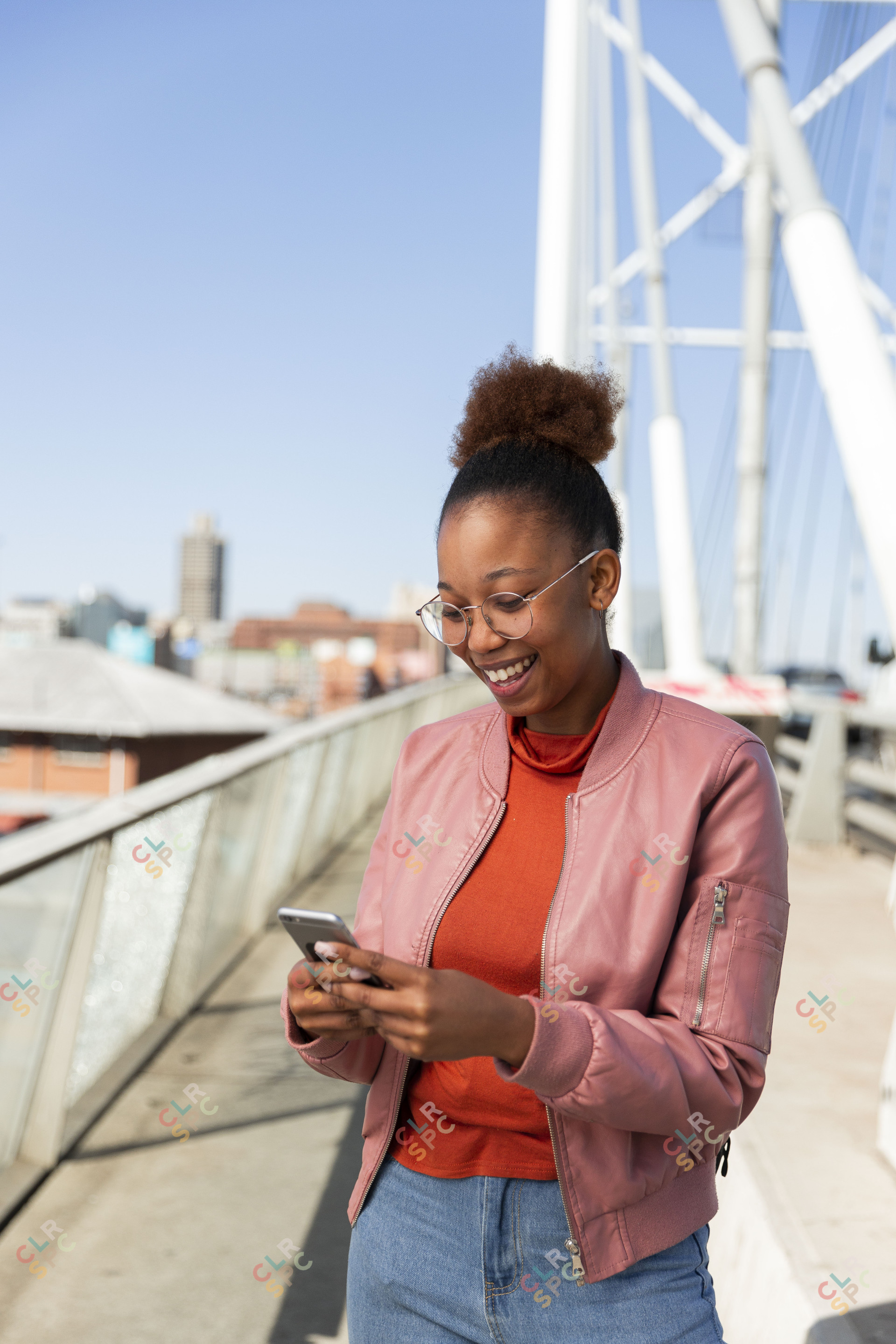 Black woman on Nelson Mandela bridge smiling