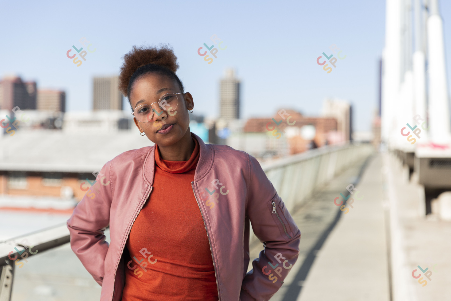 Black woman on Nelson Mandela bridge looking at camera