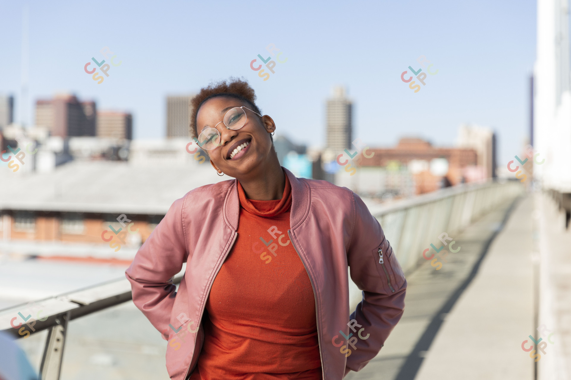 Black woman on Nelson Mandela bridge grinning