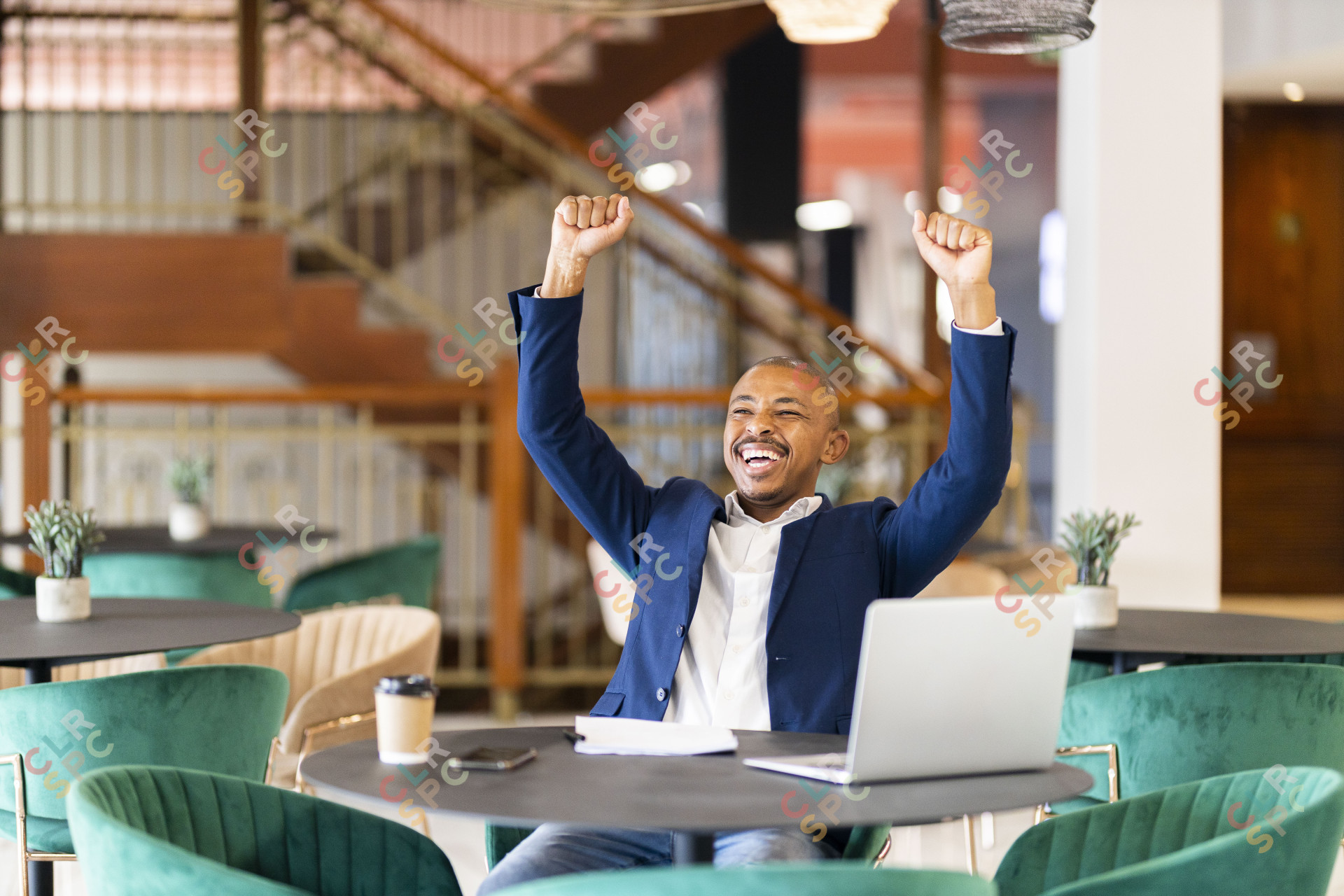 Black business man at work celebrating