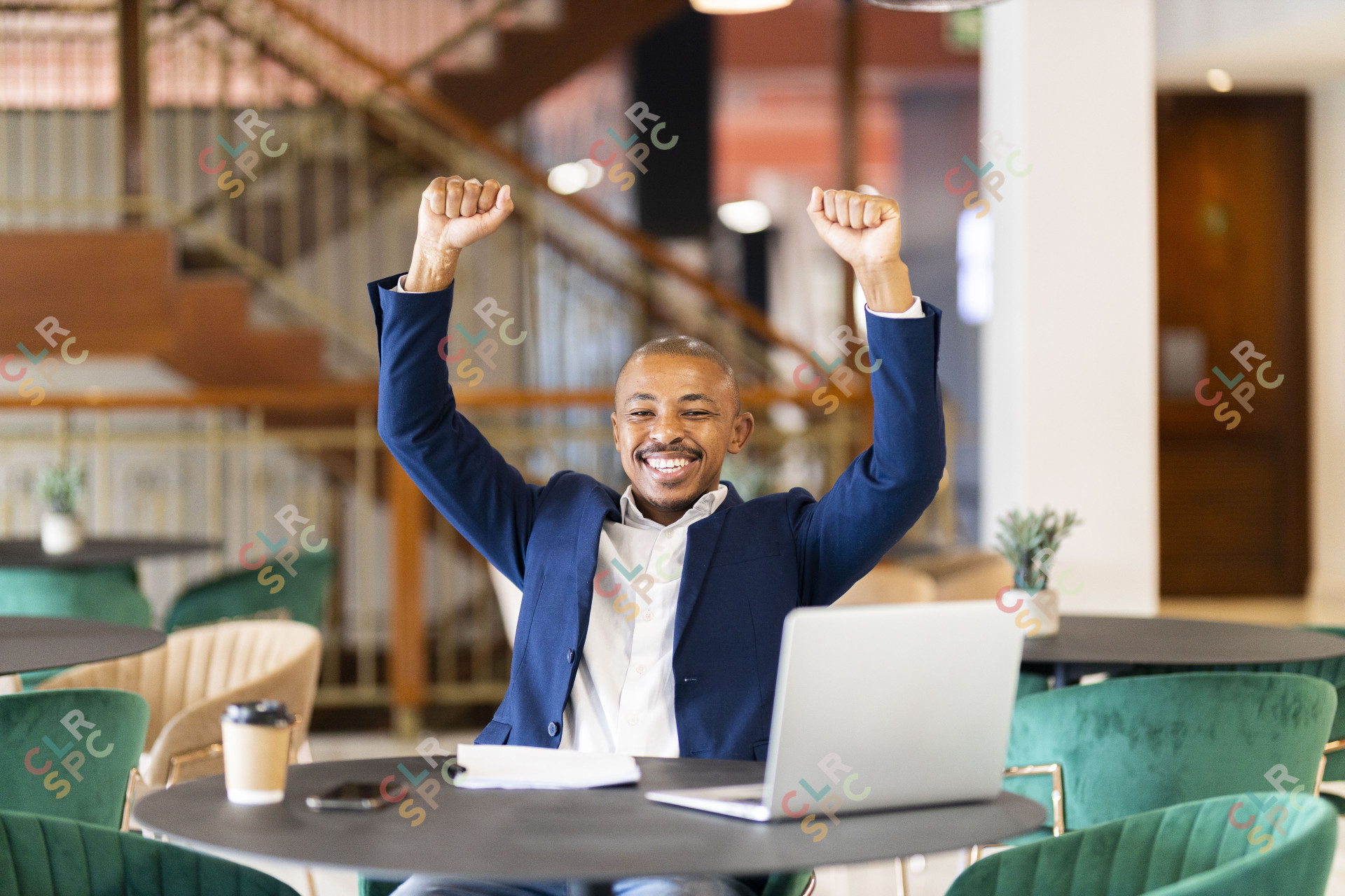 Black business man at work celebrating