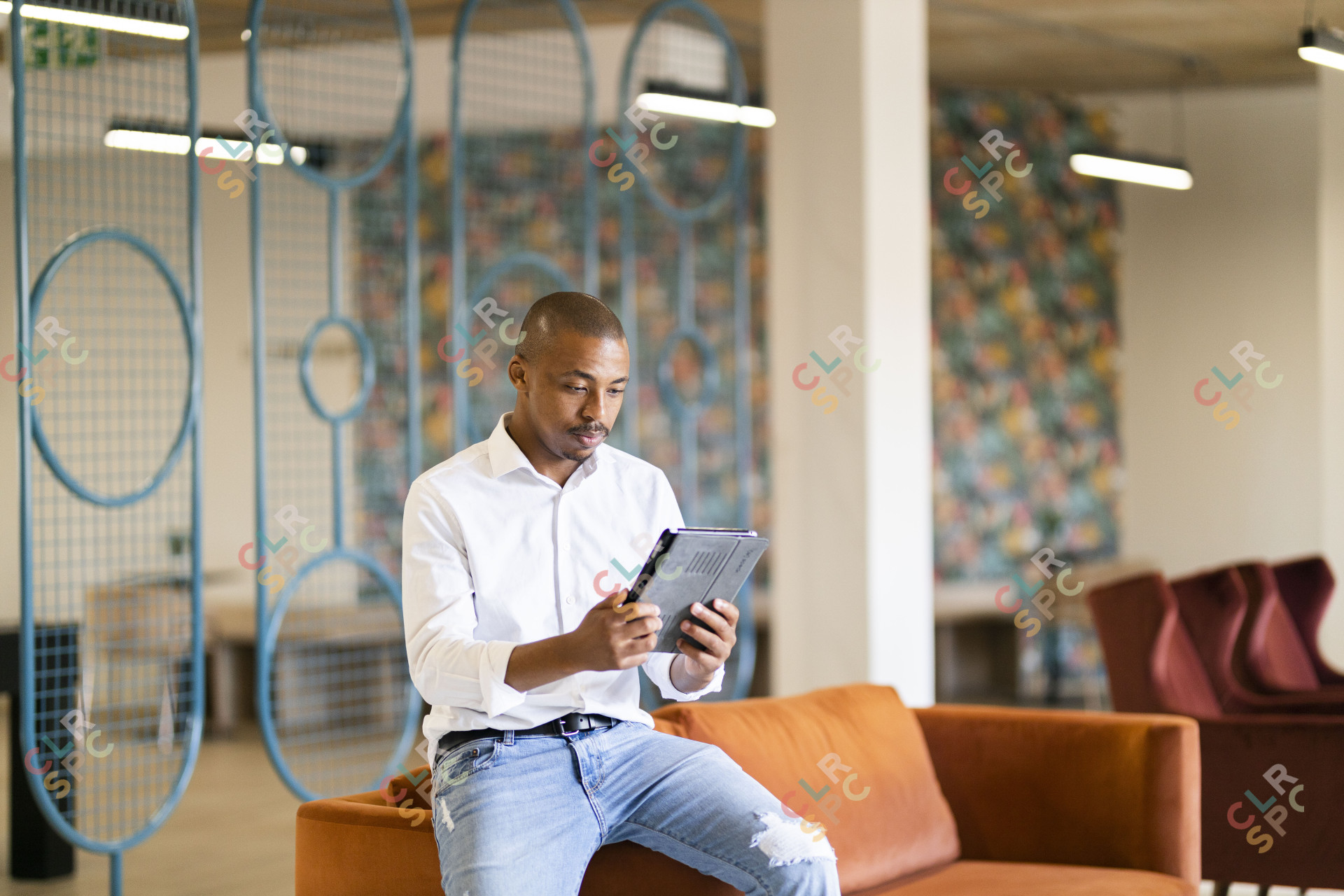 Black man looking at ipad