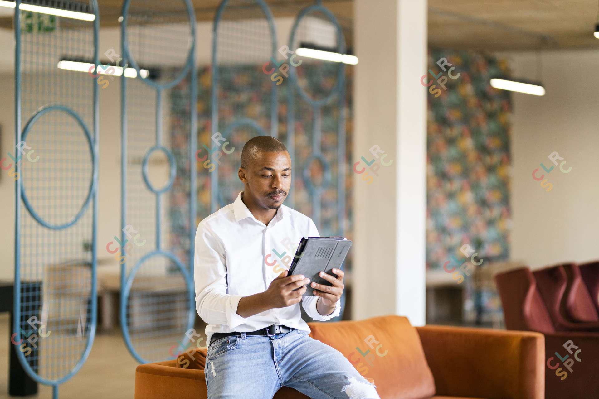 Black man looking at ipad
