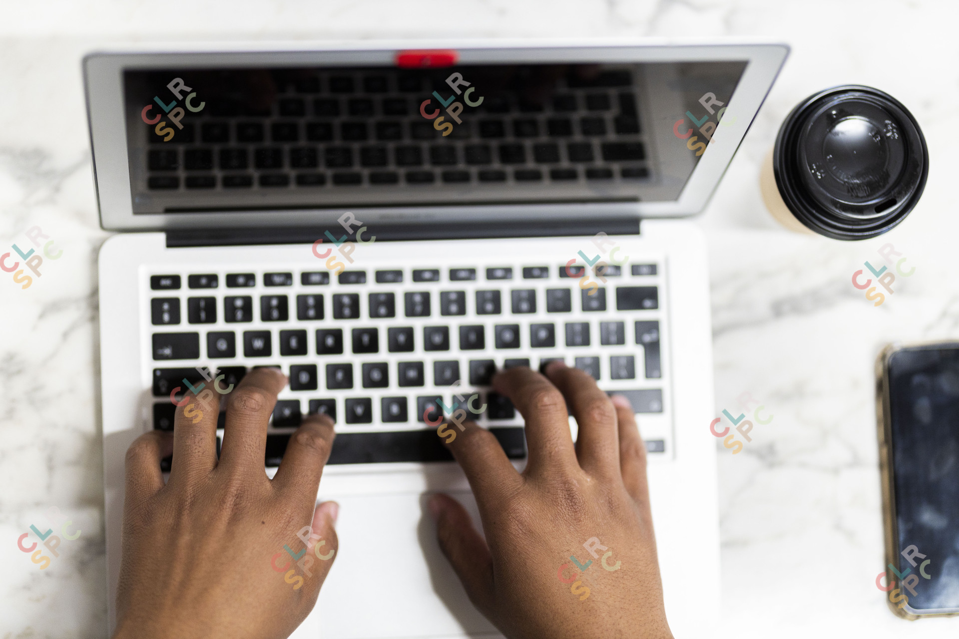 Black hands working on the laptop