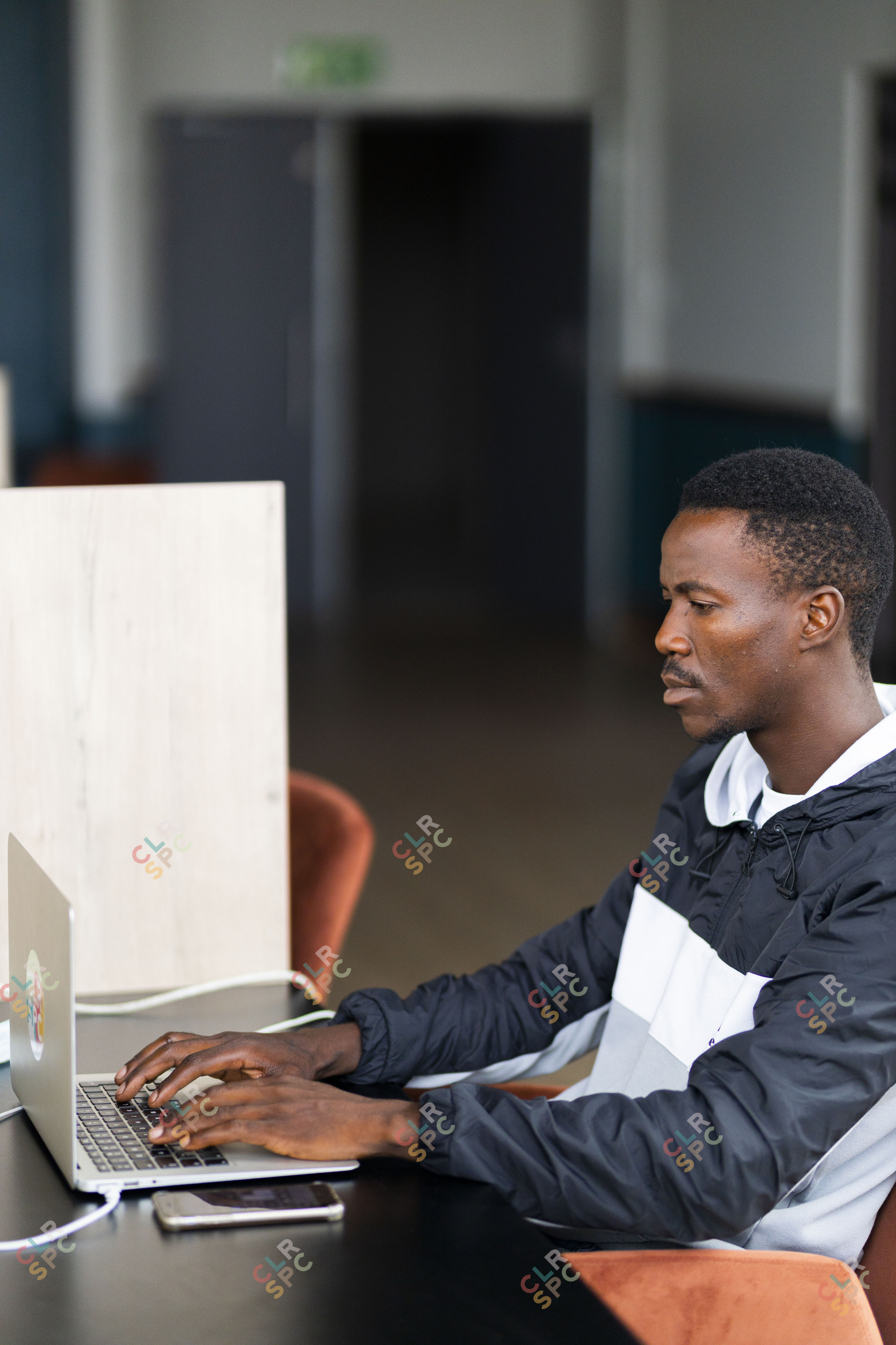 Black man working on the laptop