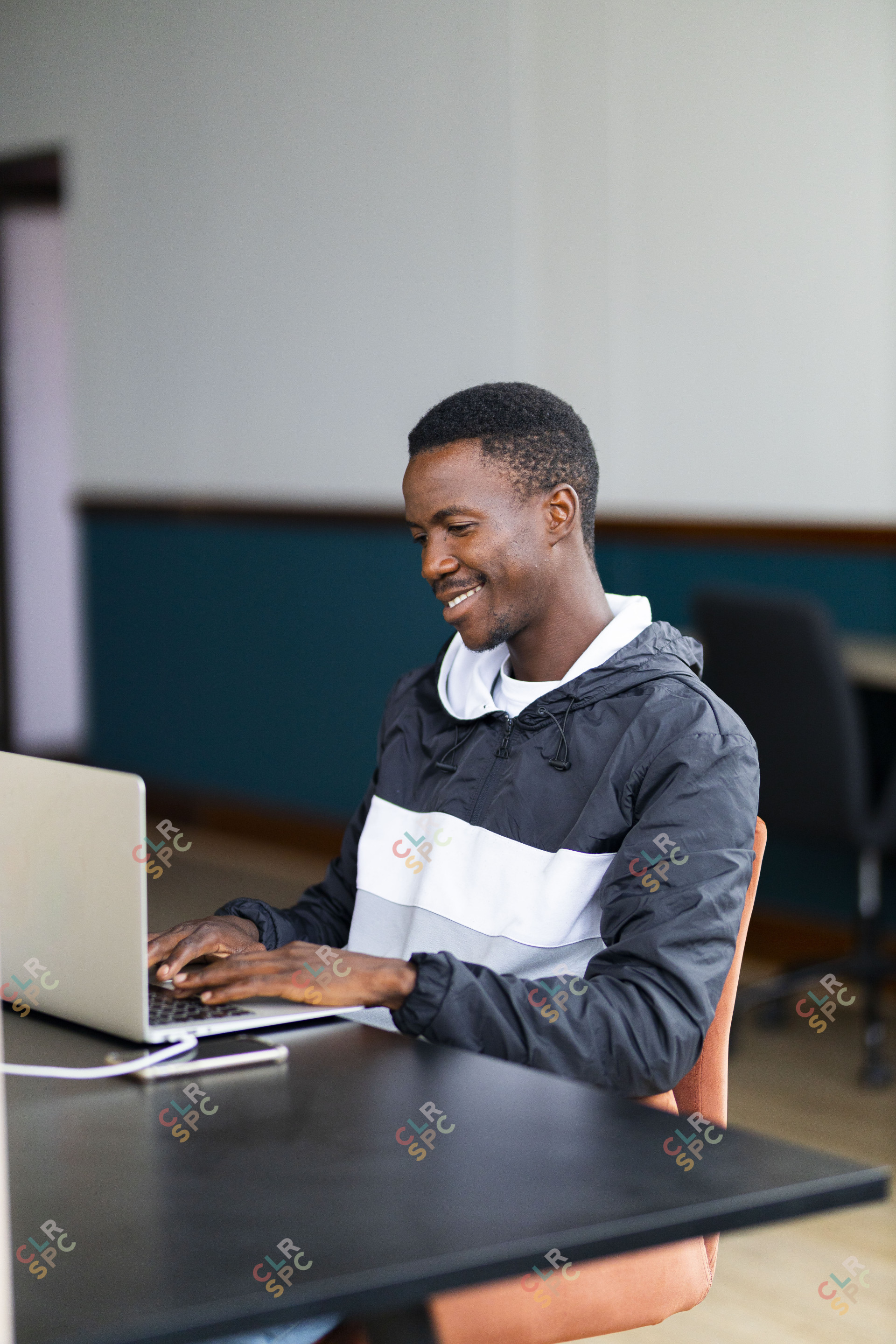 Black man working on the laptop at the office