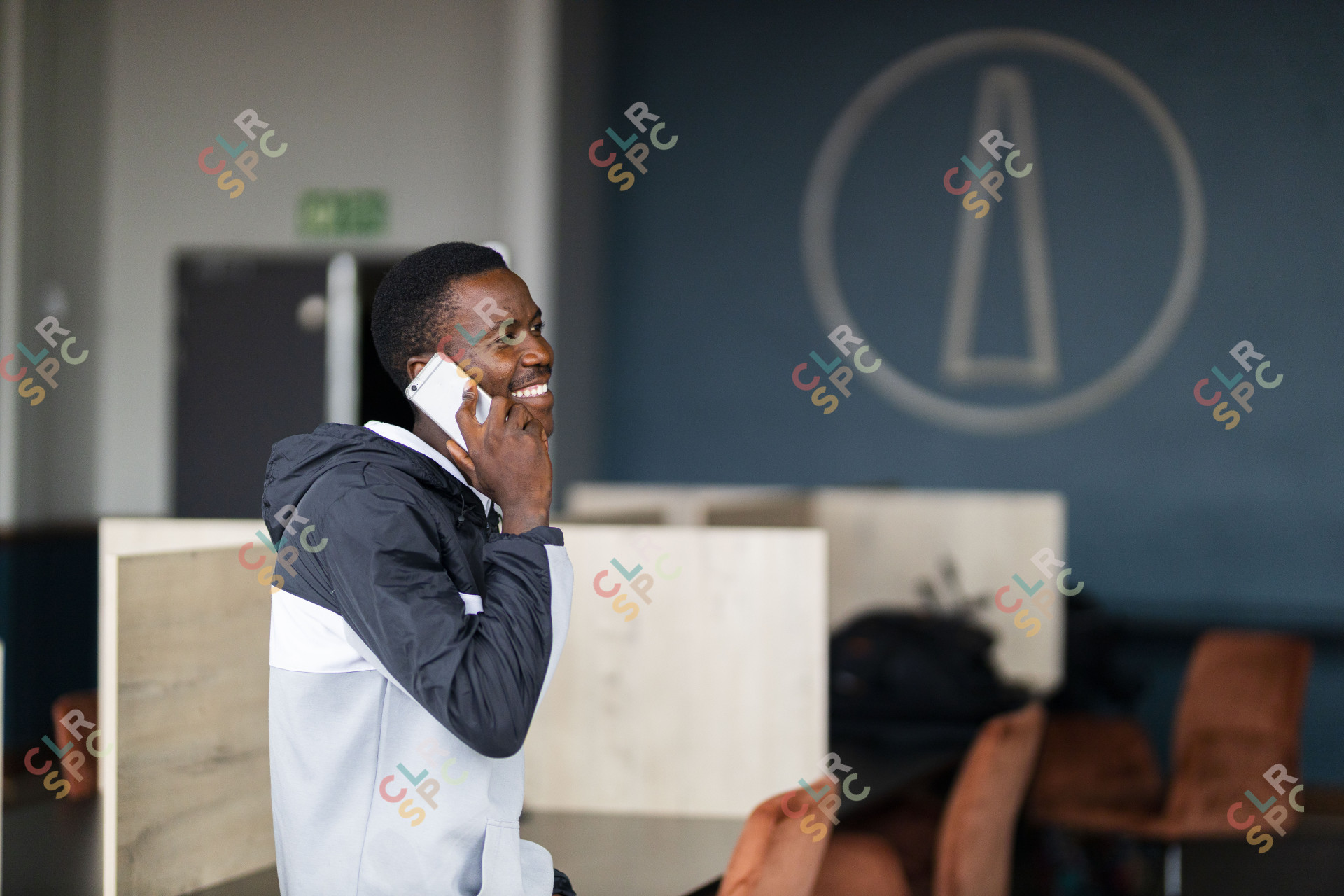 Black man talking on his cellphone and smiling
