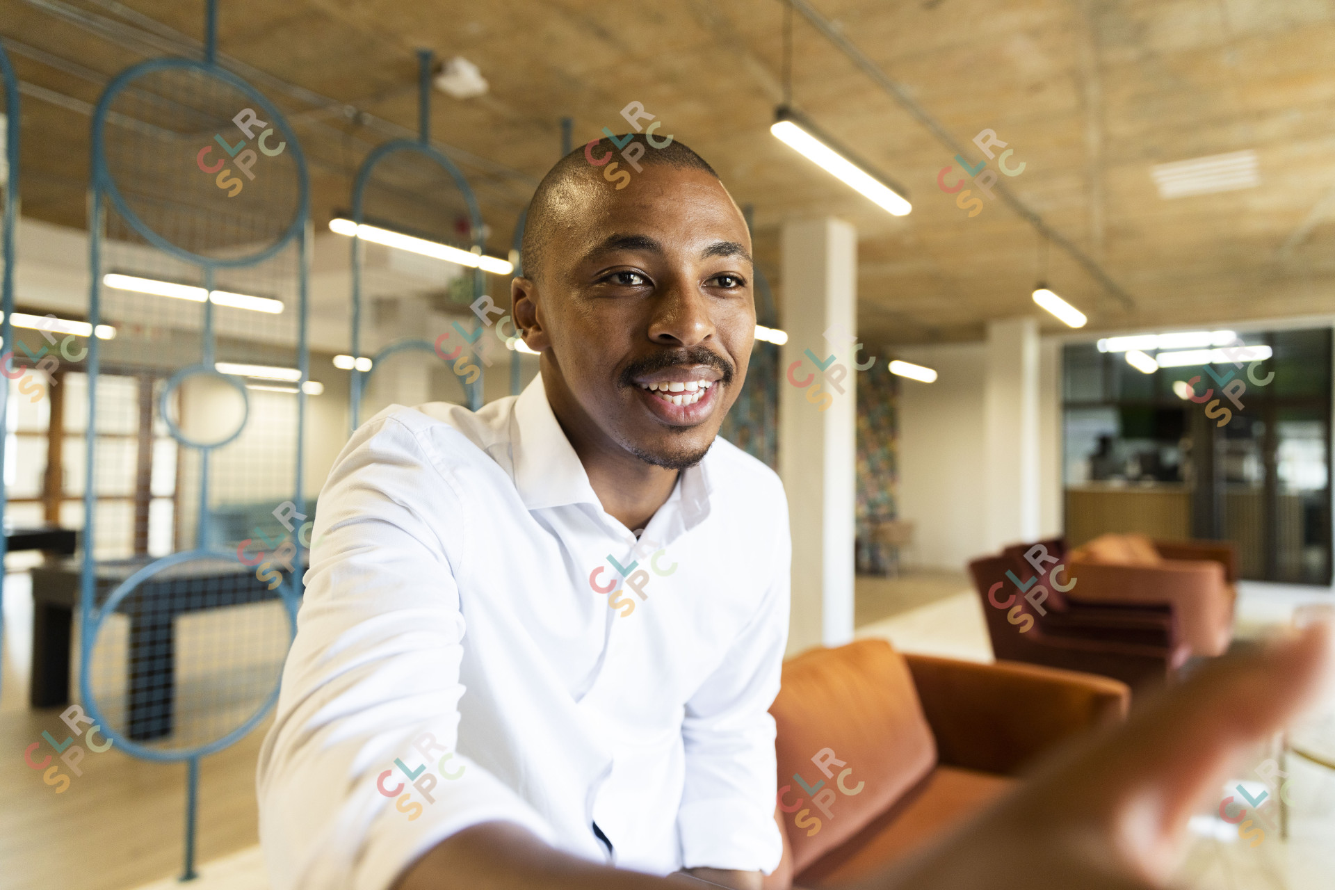 Black business man approaching to shake hands