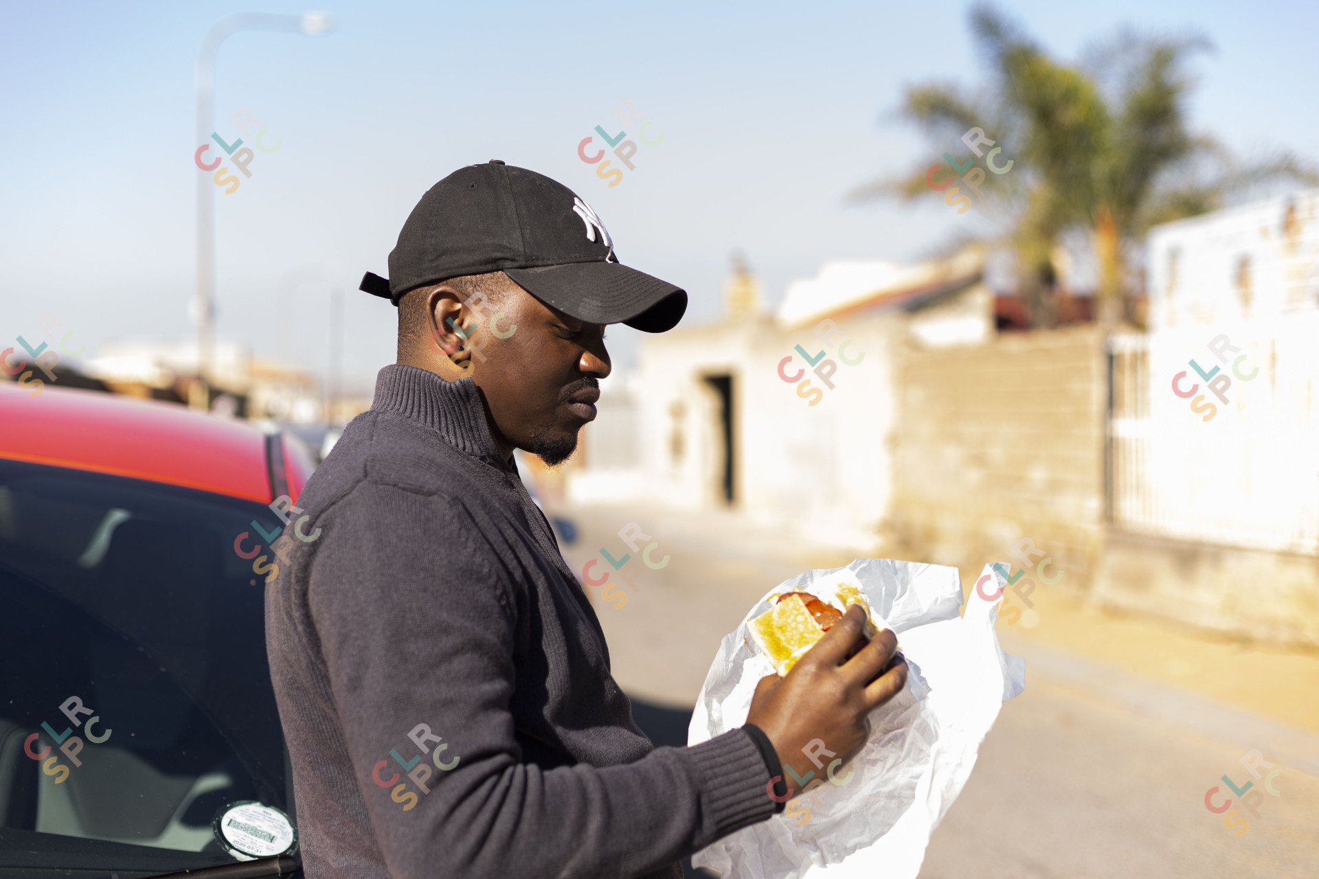 Black man eating a kota