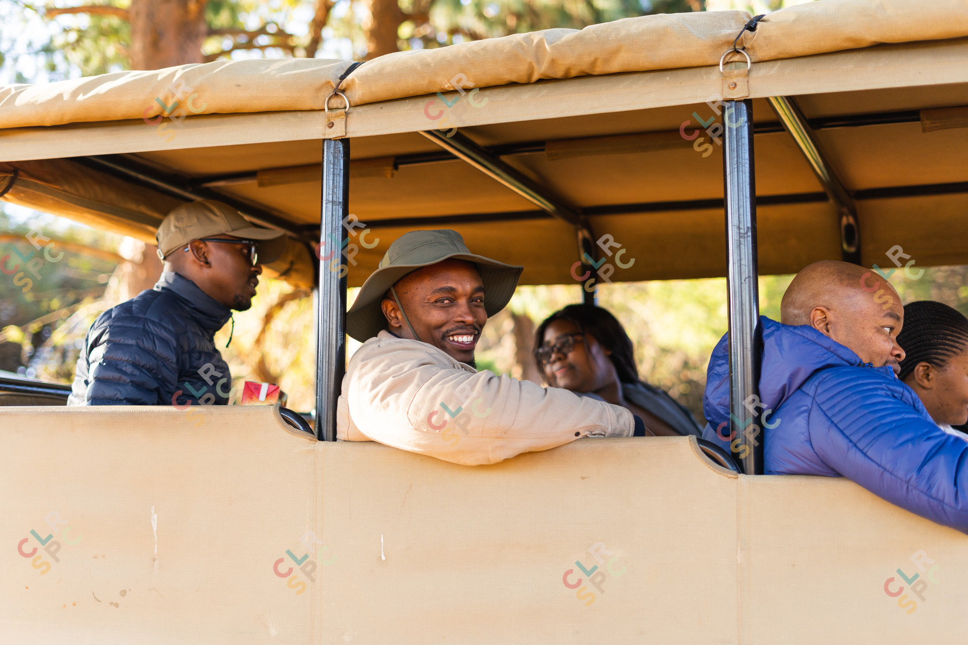 Black people going for a game drive in sunny South Africa