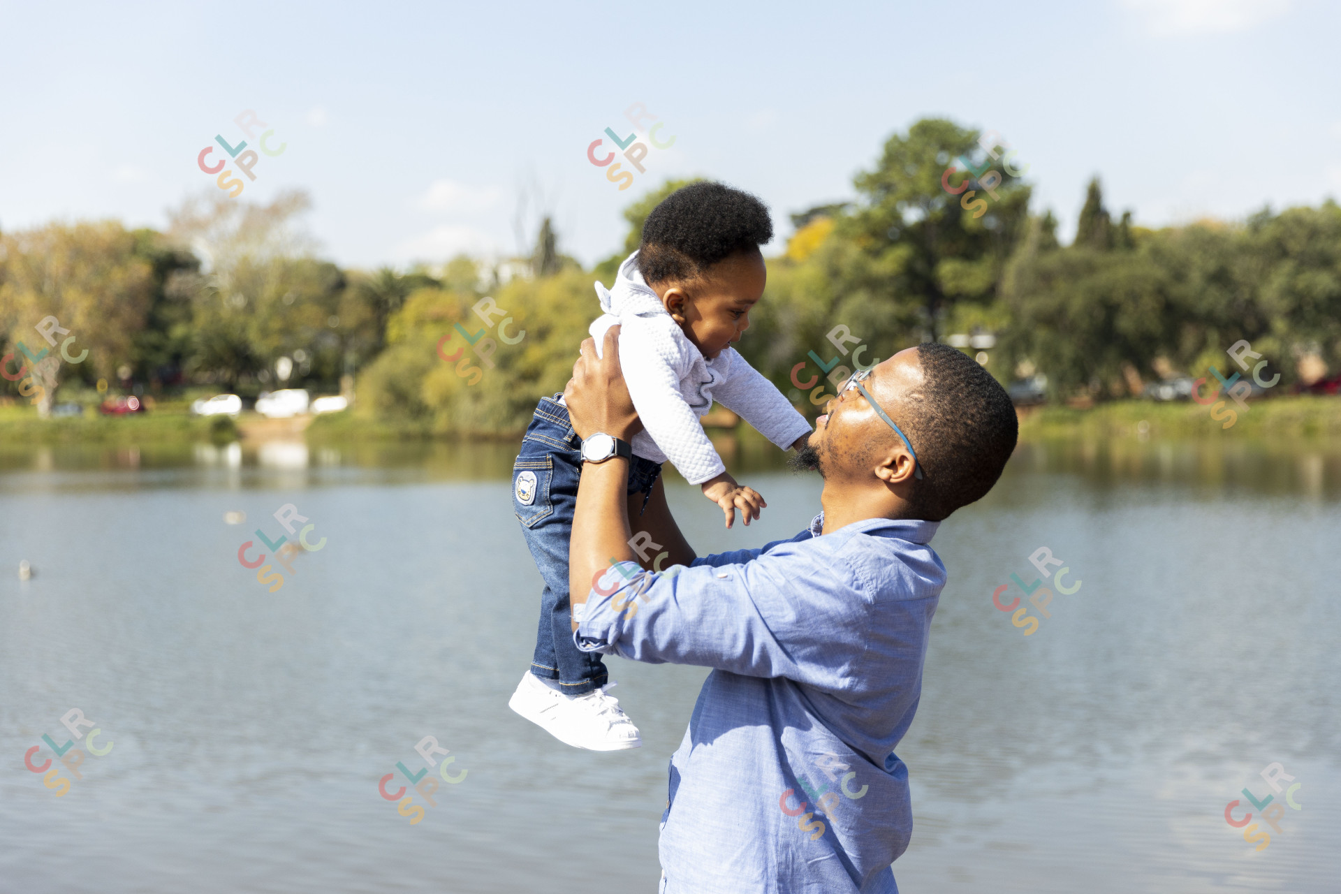 Father and son by the dam together enjoying themselves