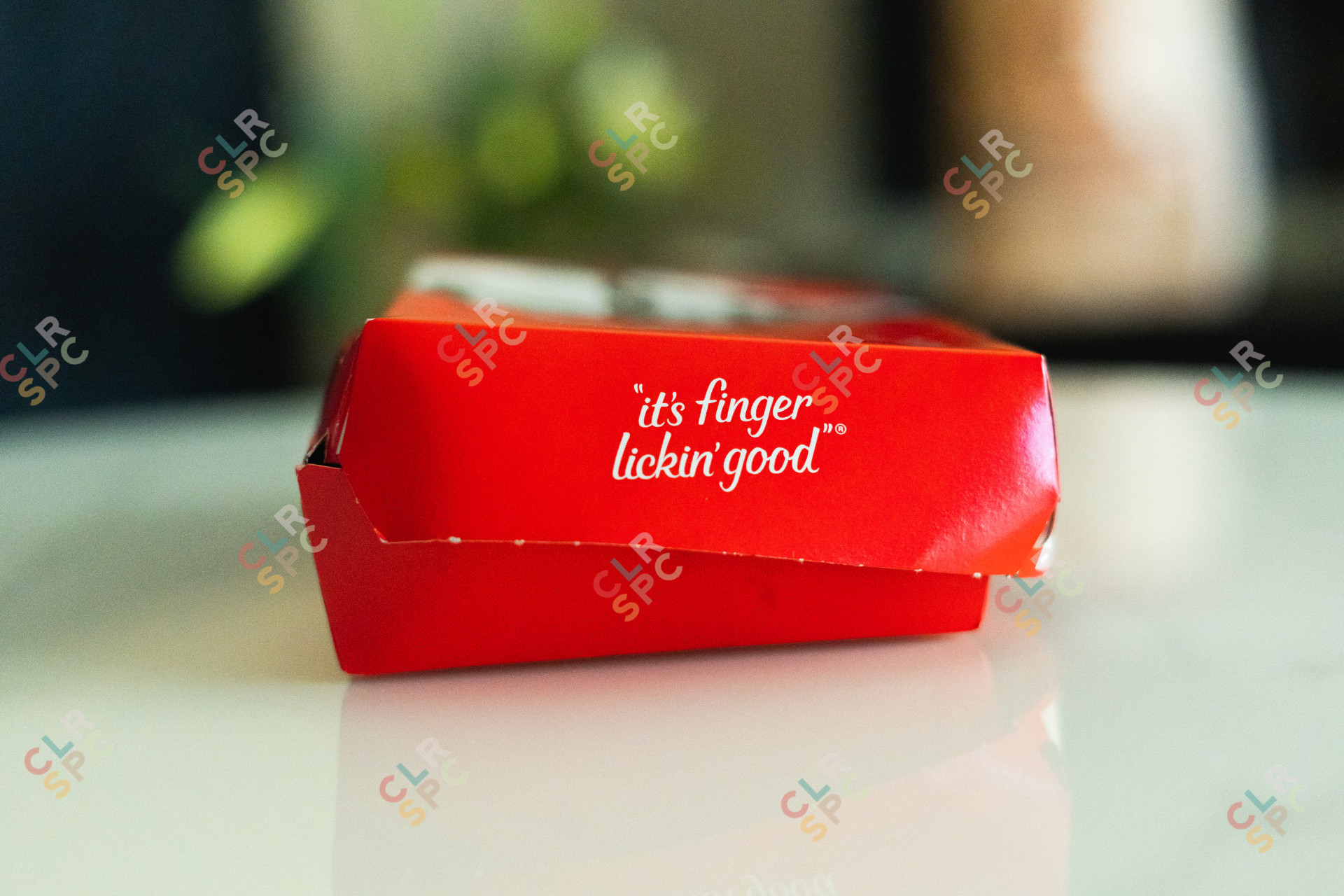 It's finger licking' good slogan on a KFC meal box.