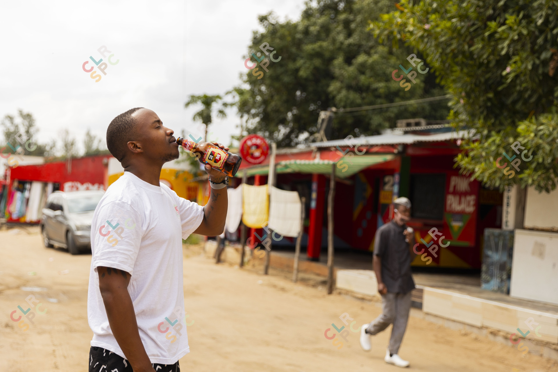 Drinking a beer in the streets of Mozambique.