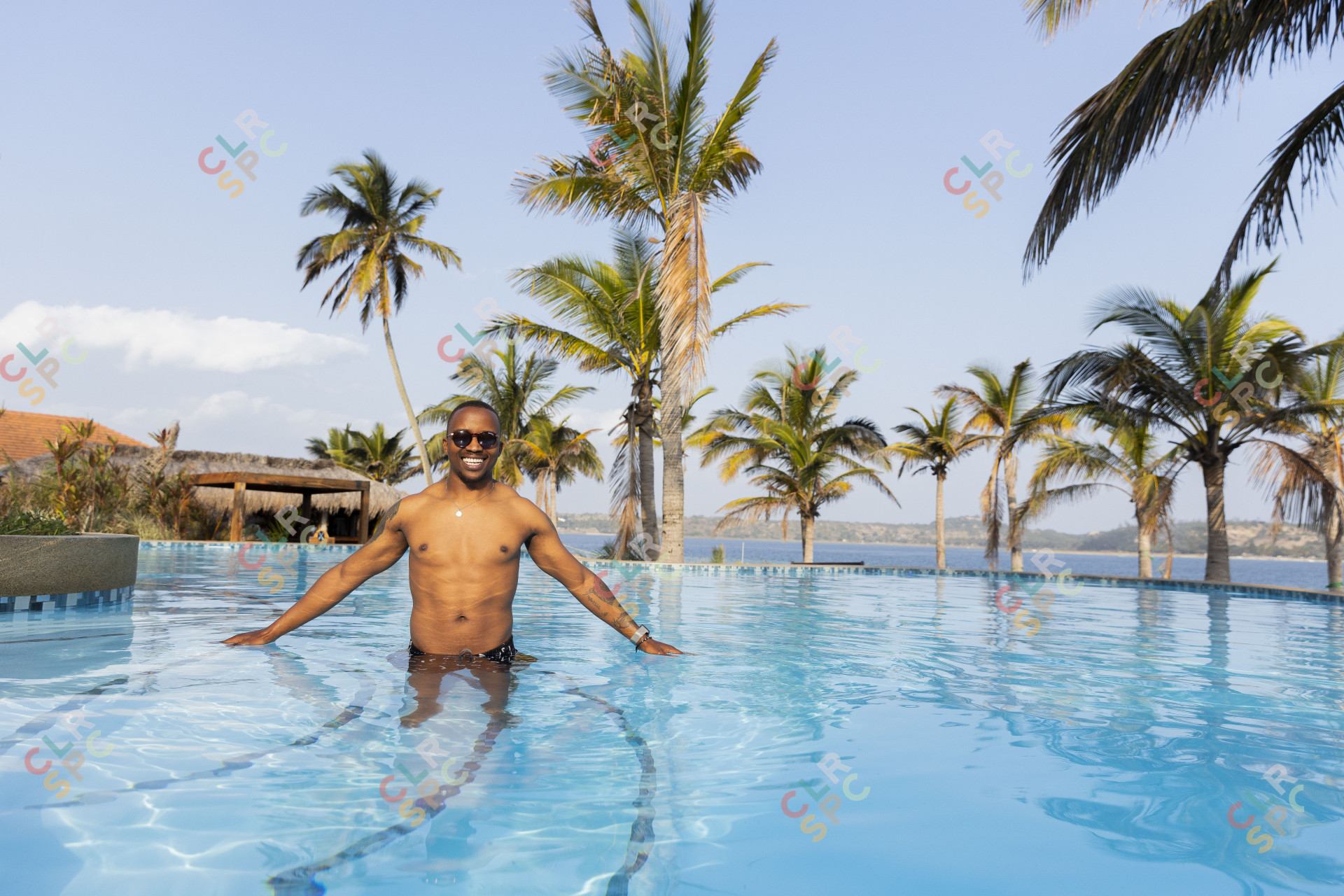 Black man enjoying the sun and swimming pool.