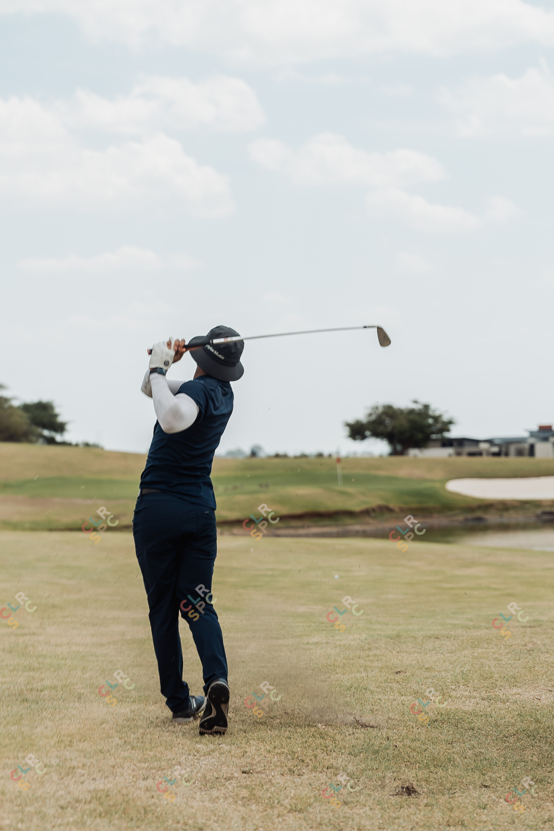 Black male golfer taking the perfect shot under pressure