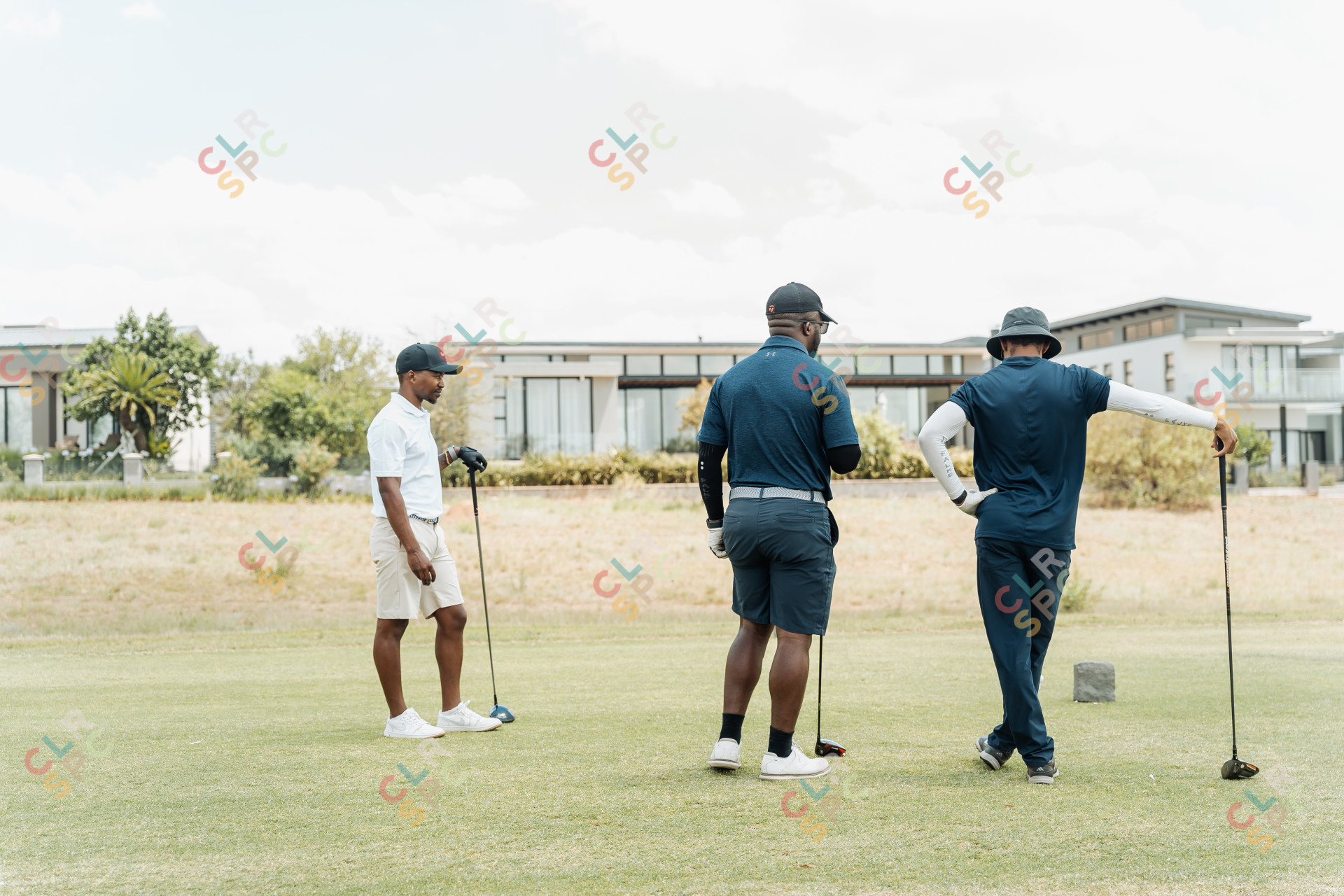 Black male golfers discussing the next hole