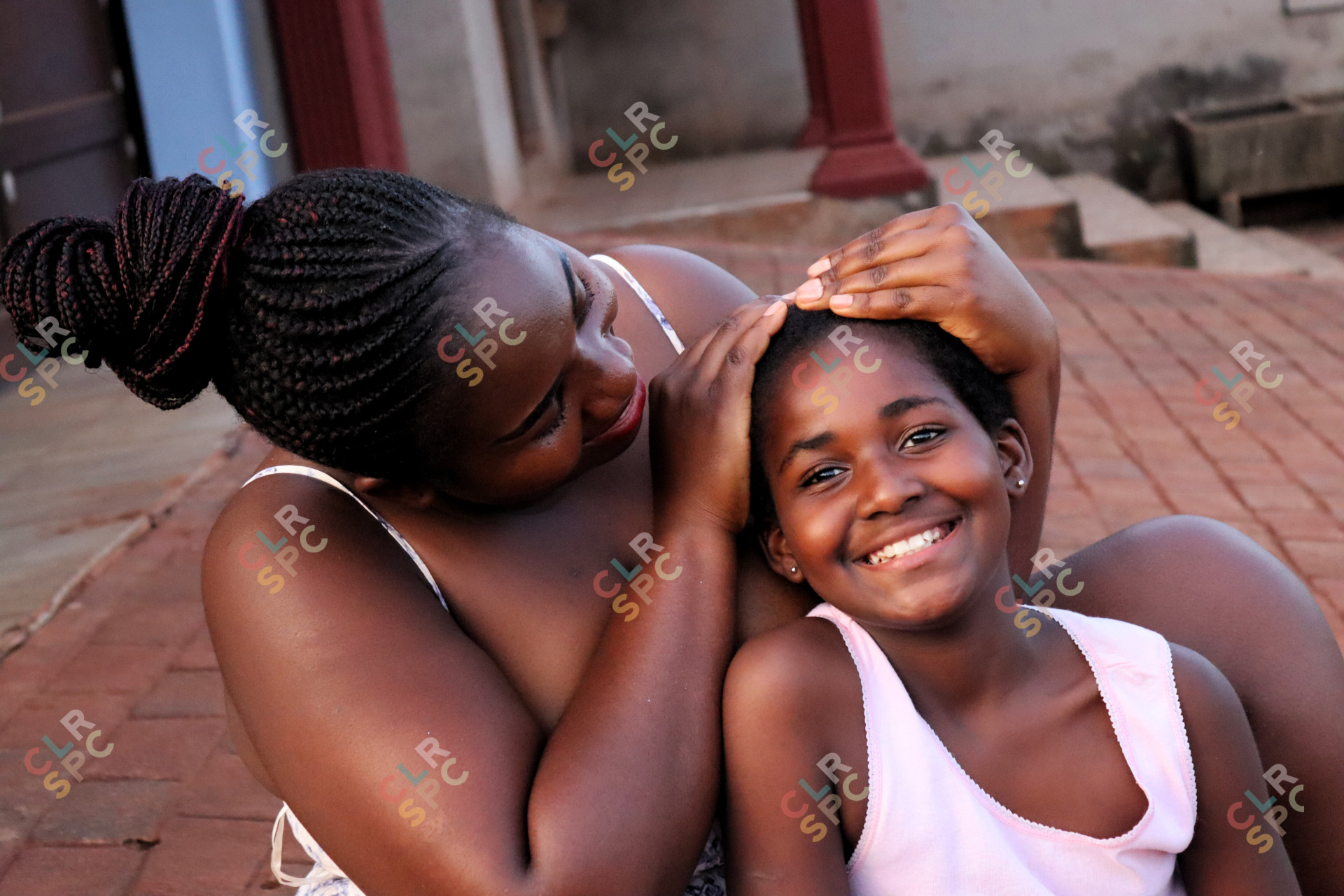 Black woman showing affection to her child
