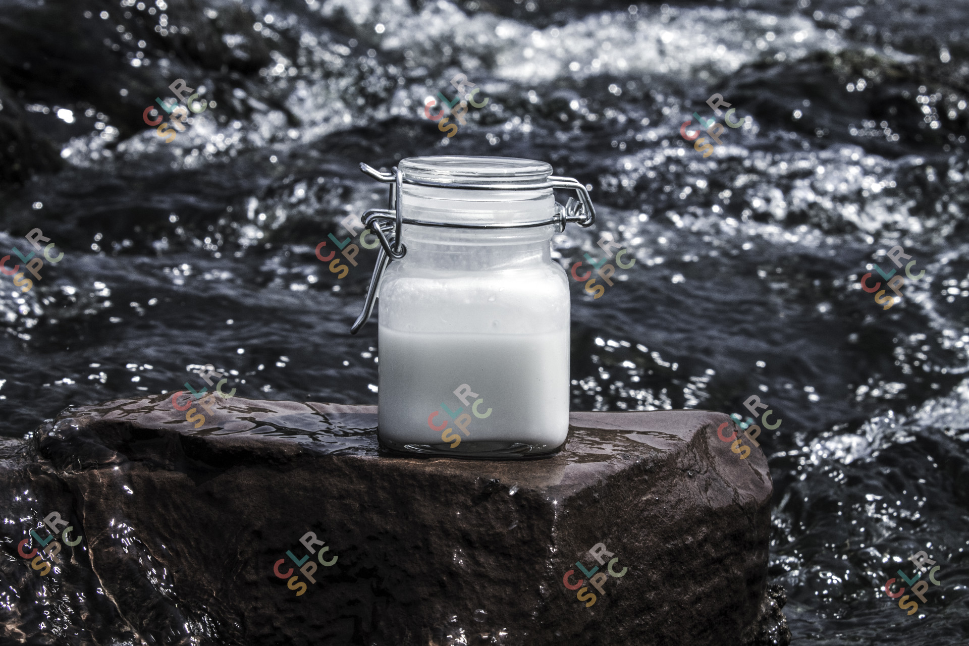White product bottle on a rock