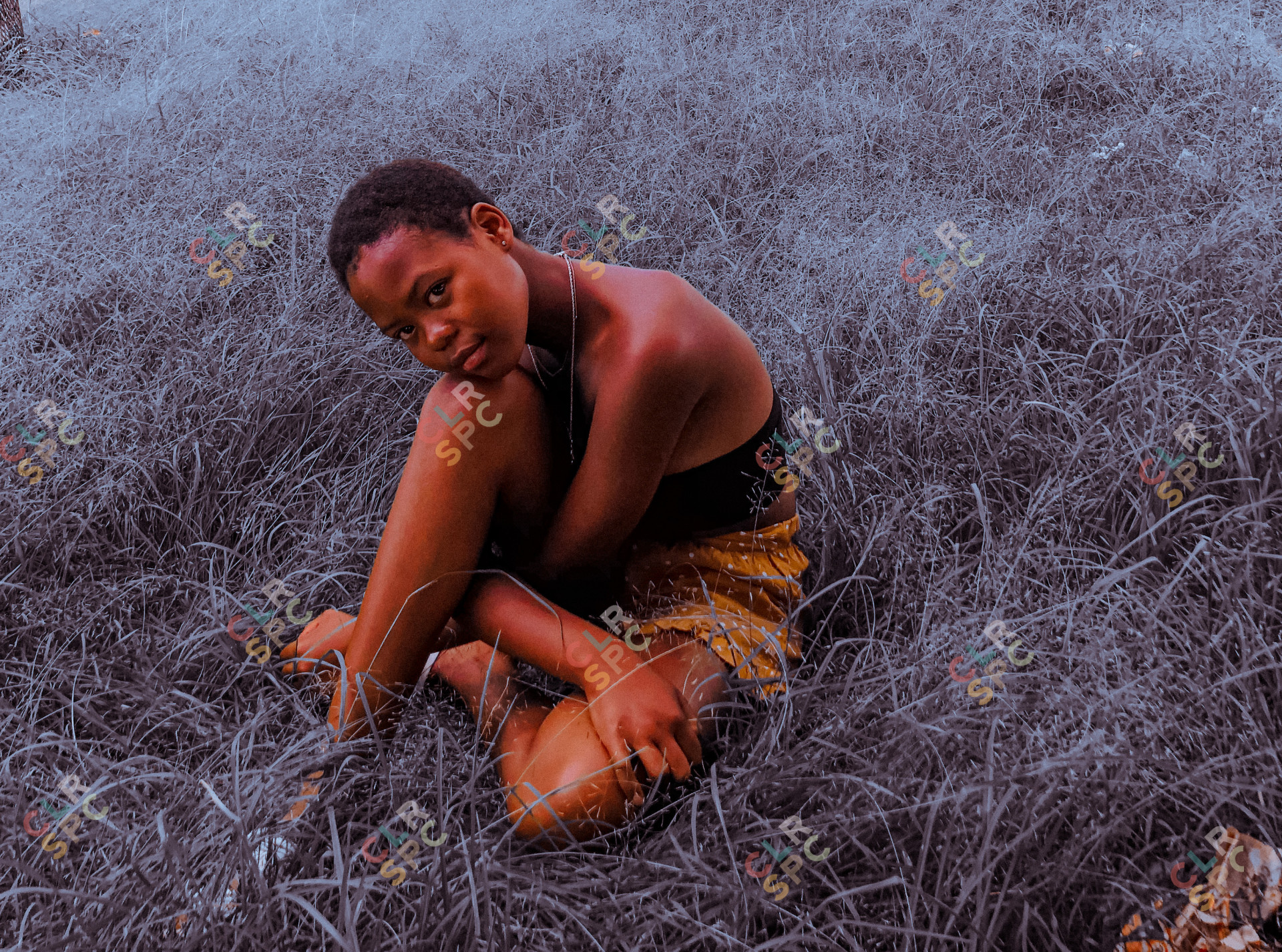 Black girl sitting on grass