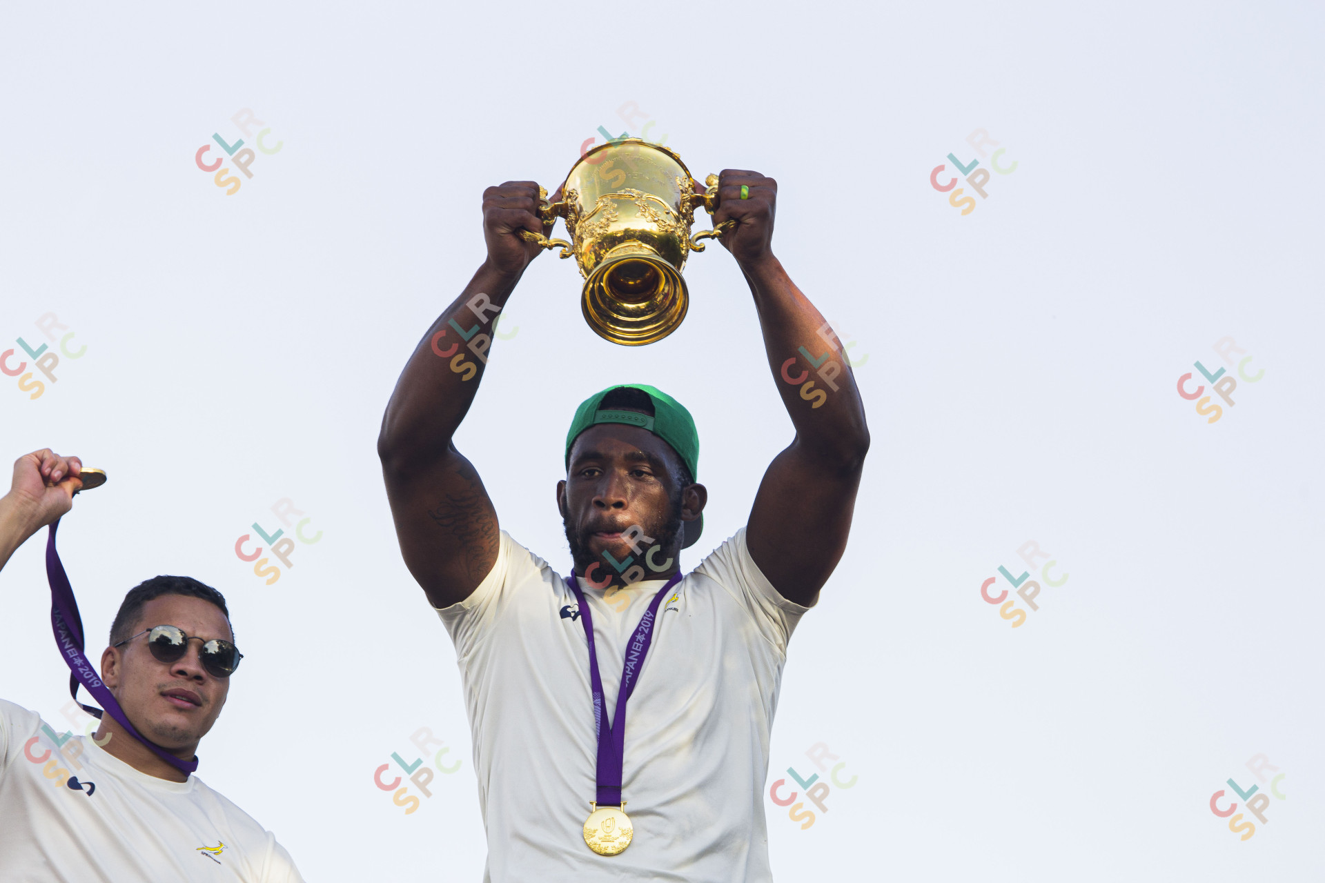 Siya Kholisi holding the Rugby World Cup trophy