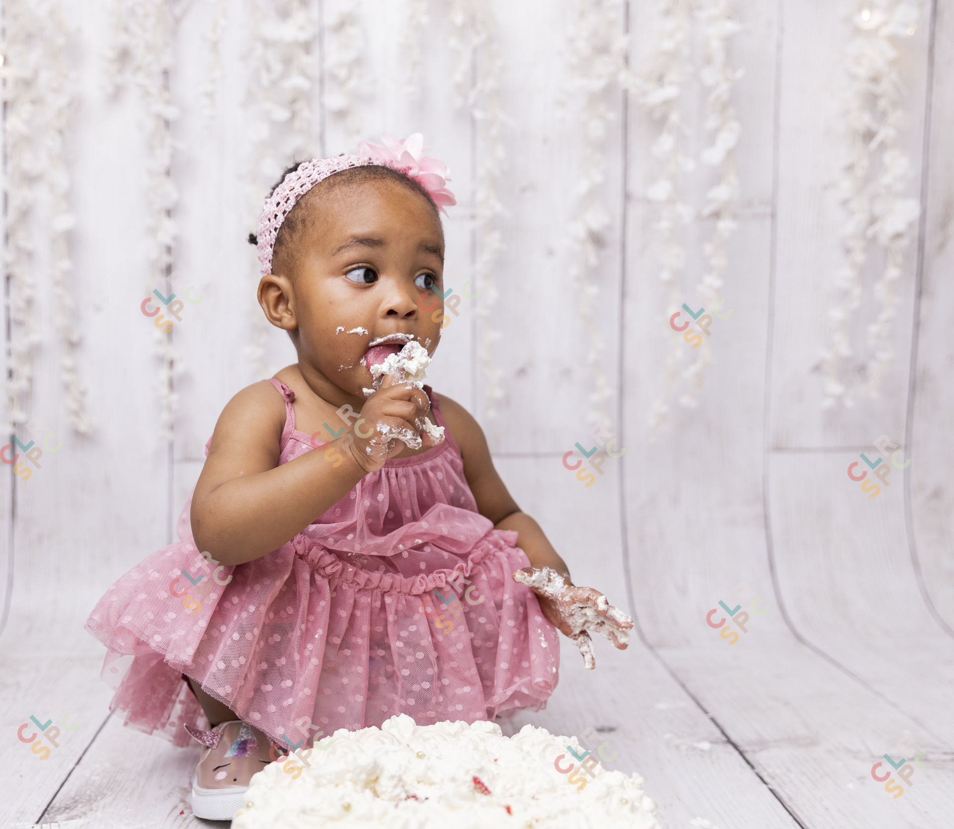Black child playing with cake