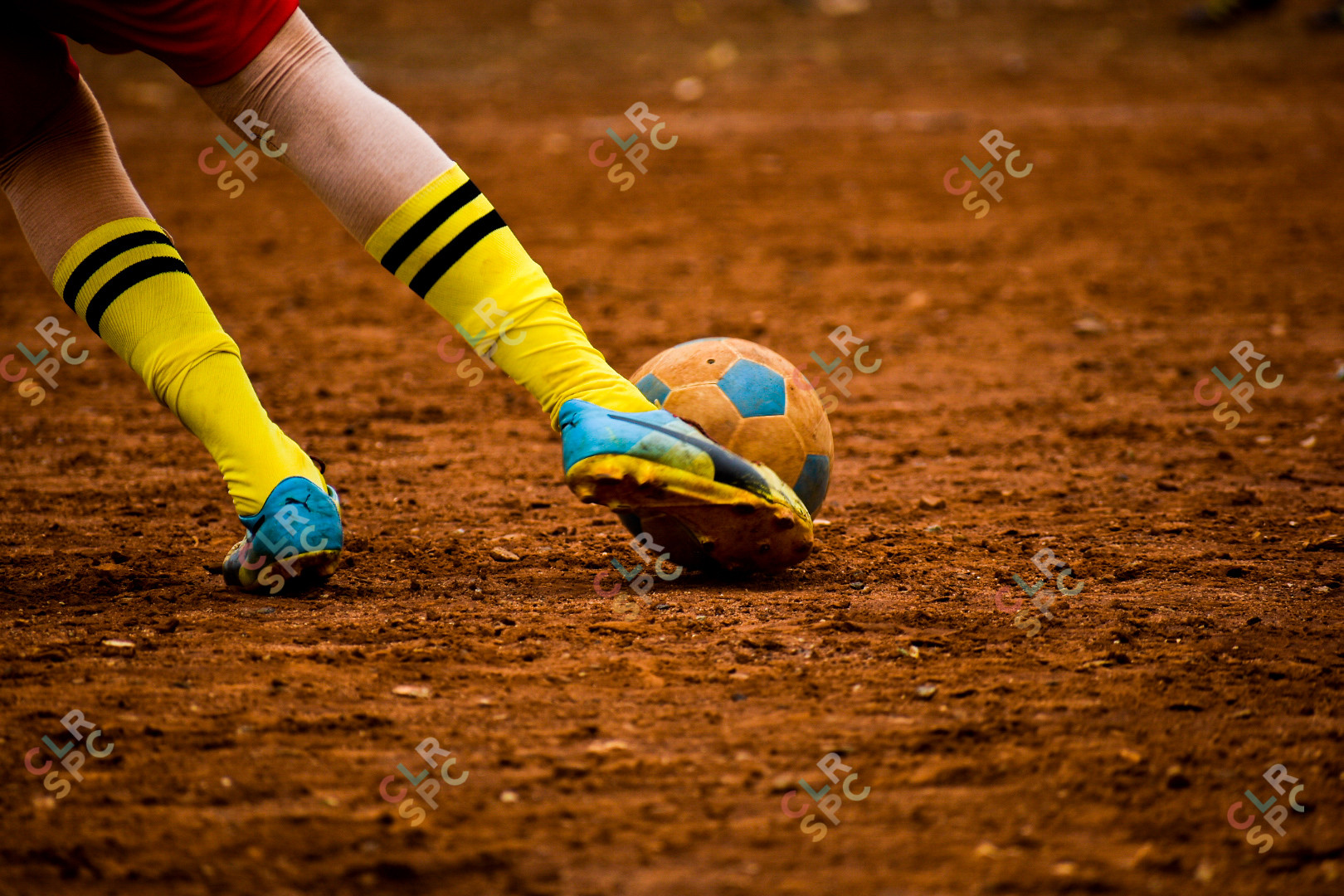 Goal kick in the dust