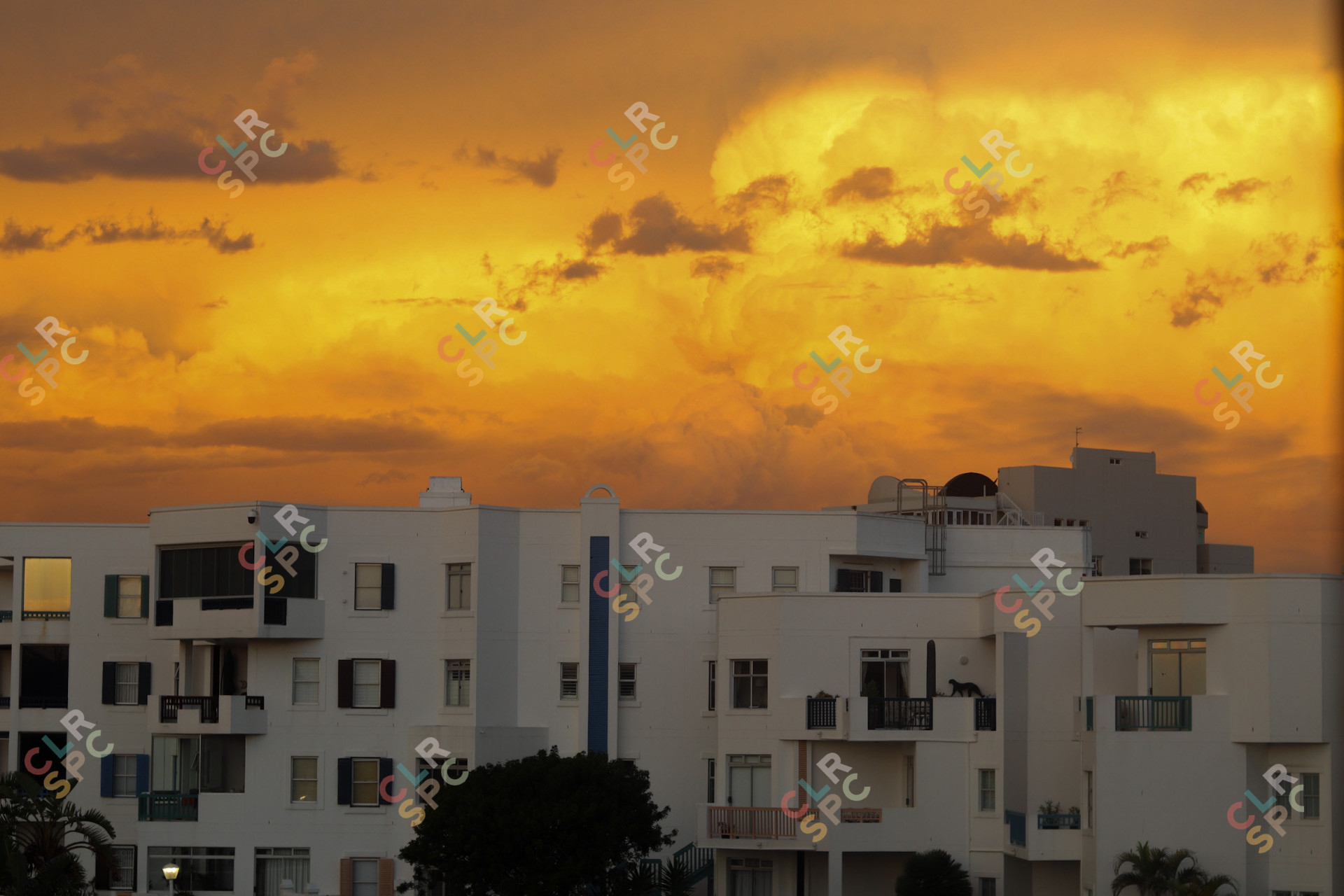 Sunset over white building