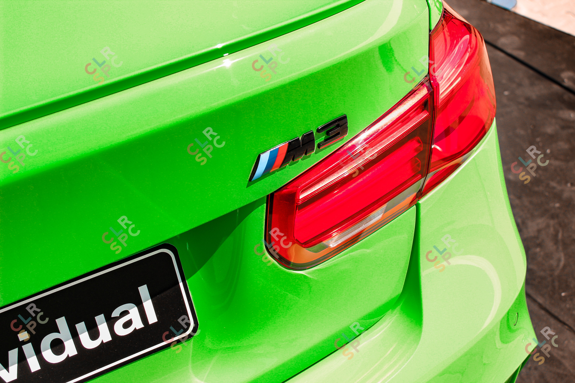 Rear of the BMW M3 (F80) Comp in BMW Individual Signal Green Colour