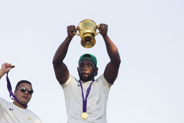 Siya Kholisi holding the Rugby World Cup trophy