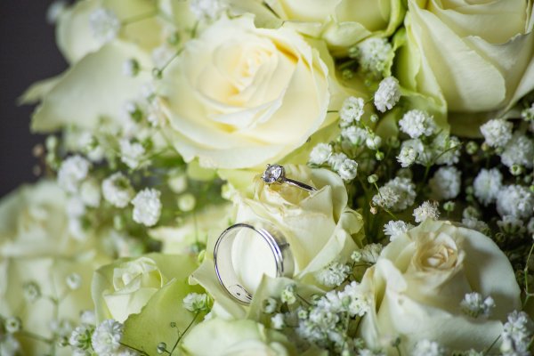 Wedding rings inside white flowers