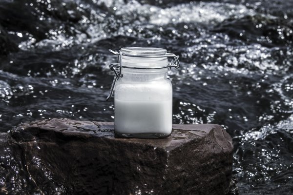 White product bottle on a rock