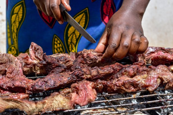 Woman cutting meat
